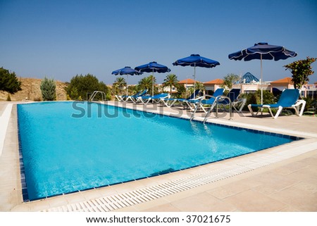 Small swimming pool in sunny resort