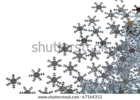 Christmas decoration of silver confetti snow flake against white background with nice bokeh