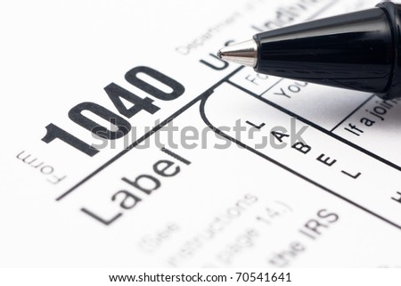 Filling in american individual tax form 1040 by ball-pen