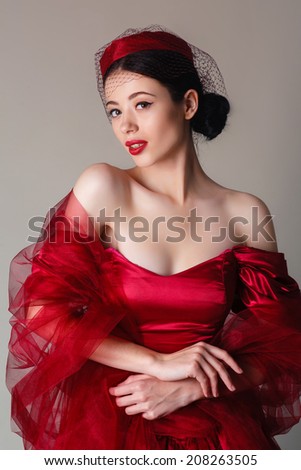 young girl in retro dress in the studio
