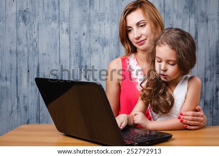 mom and daughter with laptop