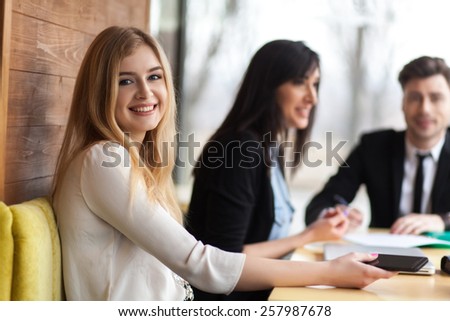 business. people at work. girl smiling at the camera