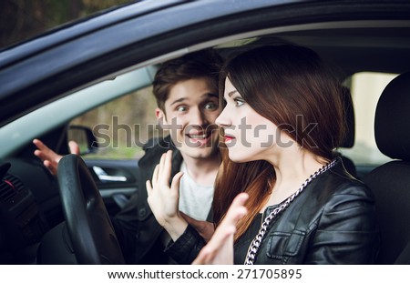 quarrel in the car, the couple quarrel in the car, the woman behind the wheel of a car