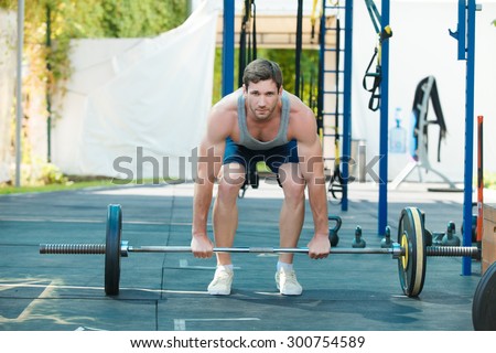 Male sports model exercising outside as part of healthy lifestyle.
