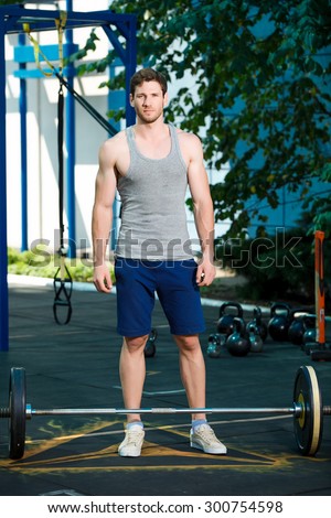 Male sports model exercising outside as part of healthy lifestyle.