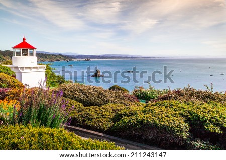 Memorial Lighthouse in Trinidad California, colorful flowers view and colorful bay