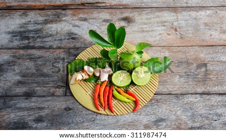 Fresh herbs and spices (chili, garlic, ginger, lemon, kaffir lime leaves)