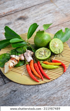 Fresh herbs and spices (chili, garlic, ginger, lemon, kaffir lime leaves)