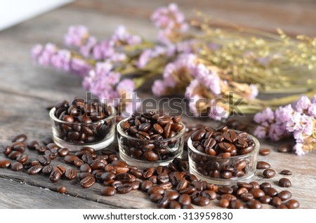 roast coffee in glass on the wood background with dark and light