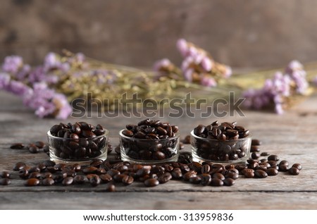 roast coffee in glass on the wood background with dark and light