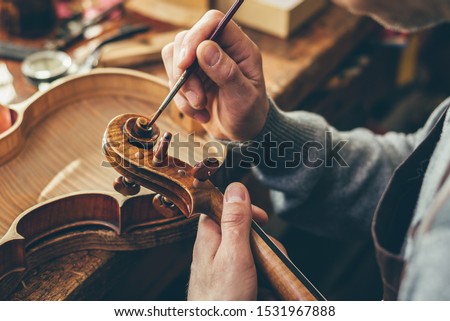 Image, Stock Photo Craftsman with violin in professional workshop