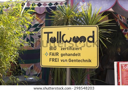 MUNICH JULY 11: sign with logo of Tollwood summer festival standing in front of a tent in Munich, Germany on July 11th, 2015.