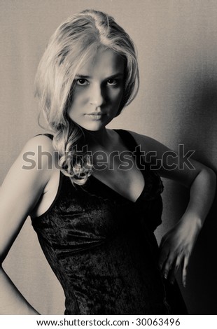 Black and white portrait of blonde in black dress