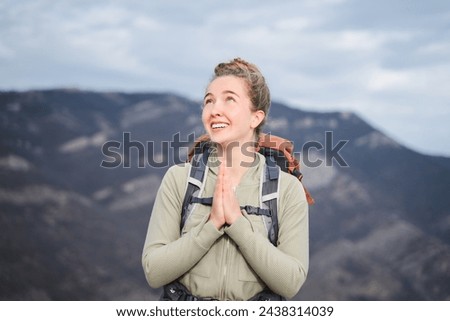 Similar – Image, Stock Photo Pleased tourist with backpack taking selfie on smartphone sitting on bridge above mountain river