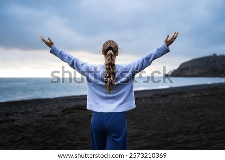 Similar – Image, Stock Photo Unrecognizable woman enjoying freedom near waving sea