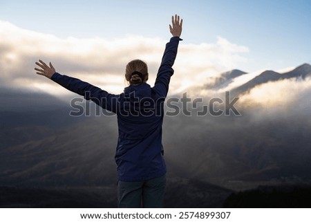 Image, Stock Photo Unrecognizable woman enjoying freedom near waving sea