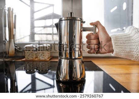 Similar – Foto Bild Frischer Kaffee in der Nähe der Kanne und der Kaffeekörner