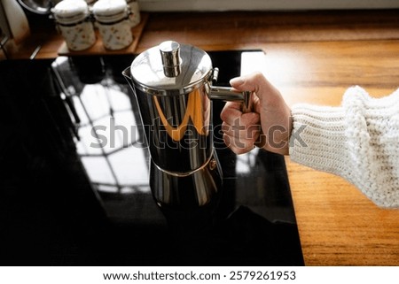 Similar – Foto Bild Frischer Kaffee in der Nähe der Kanne und der Kaffeekörner