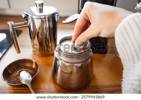 Similar – Foto Bild Frischer Kaffee in der Nähe der Kanne und der Kaffeekörner