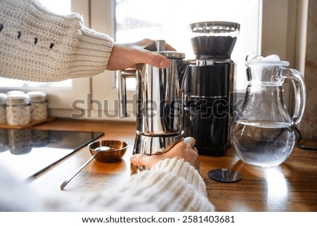 Similar – Foto Bild Frischer Kaffee in der Nähe der Kanne und der Kaffeekörner