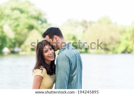 Young couple in the park laughing. outdoors.