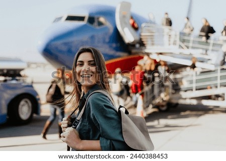 Similar – Image, Stock Photo Casual woman on airport terminal talking on the cell phone, waiting for flight departure with luggage on trolley cart.