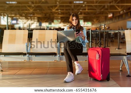 Similar – Image, Stock Photo Young woman traveler checking writing on smart phone during sunset day at Iceland, close up image.