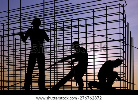 Silhouette of the workers on a background of the sky