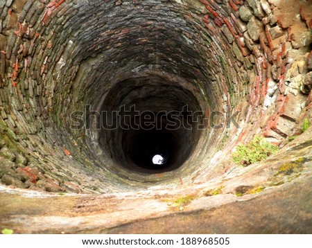 Very deep well in a ruined castle, Romania.
