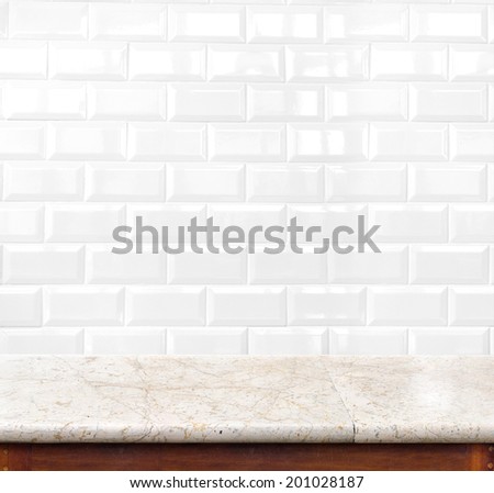 marble table and ceramic tile brick wall in background. product display template.