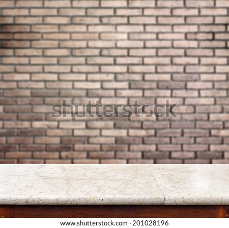 Empty marble table with blur red brick wall. template for display product