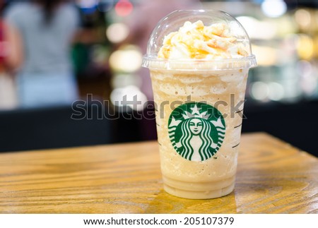 Bangkok ,Thailand-July 15 : Glass of Starbuck Coffee Frappuccino Blended Beverages served at wood table in starbuck shop at Seacon Department store, Bangkok, Thailand.