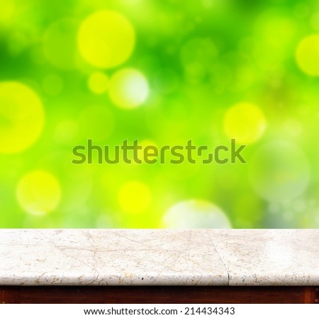 Marble table with green bokeh background,empty interior for add your product