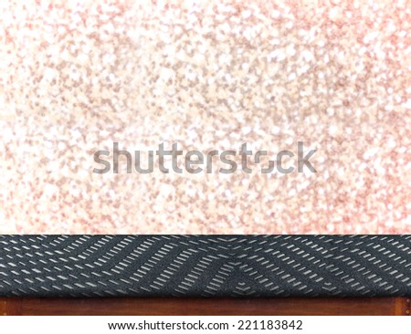 Zigzag fabric Table with bokeh pink sparkling background,Empty room for display your product