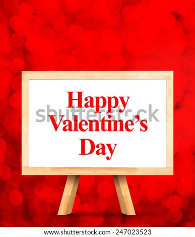 whiteboard with Happy Valentines Day word at red bokeh light background,Love concept