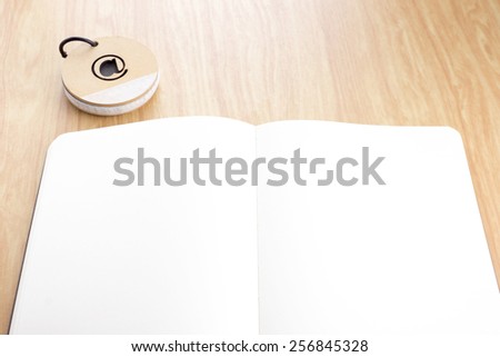 open notebook on wooden table with notepad,Template mock up for adding your content.