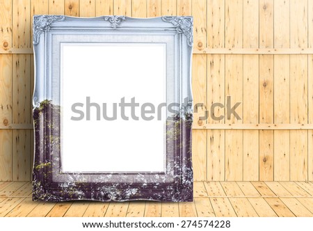Blank Vintage frame with double exposure of tree landscape image lean on marble floor and plank wooden wall,Template mock up for adding your design.
