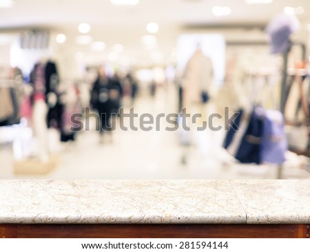 Empty marble table top and blurred store bokeh light in background, Mock up for display of product