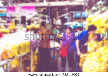 Blurred background : people shopping at flower market fair, blur background with bokeh.