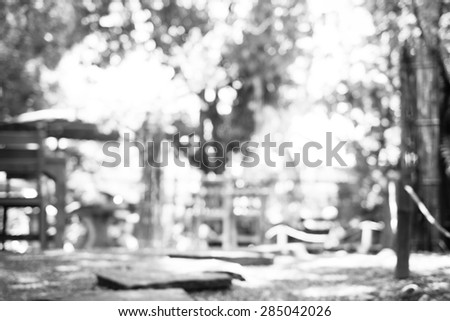Blur background : Outdoor cafe in garden with wood table with boekh light ,Black and white filter.