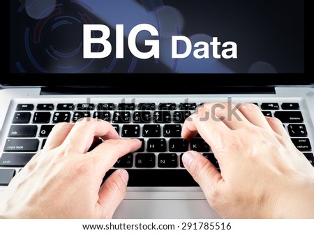 Big Data word on notebook screen with hand type on keyboard, Digital business concept.