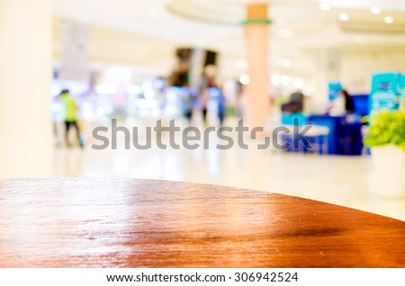 Empty round table top at store blurred background with bokeh light,Template mock up for display of your product.