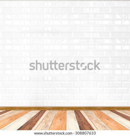 Empty white tile wall and wooden flooring,mock up for display of product.