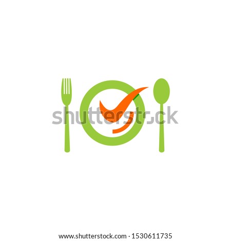 A plate with a smile on the left and right there is a fork and spoon.