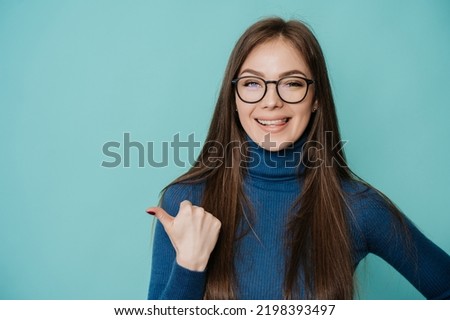 Similar – Image, Stock Photo Pretty woman with glasses portrait with christmas tree in background