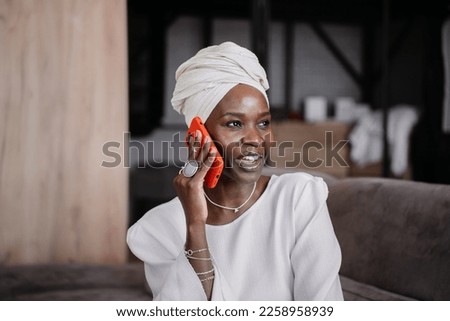 Similar – Image, Stock Photo Woman with turban speaking on mobile phone