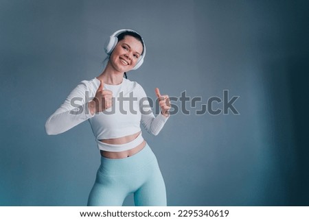 Similar – Image, Stock Photo Fit woman standing against sea during workout