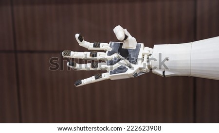 plastic robot hand with open palm gesture