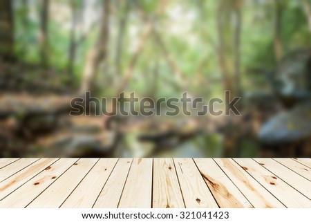 wooden floor on bokeh blur nature landscape background - for product montage or display