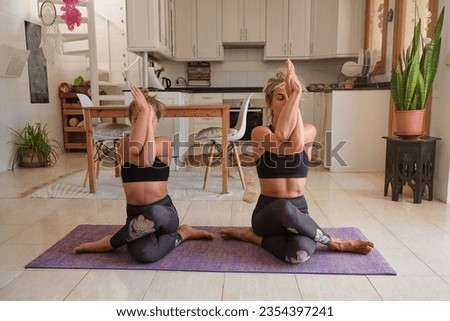 Similar – Image, Stock Photo Slim barefoot woman meditating in bound angle pose in contemporary workout room